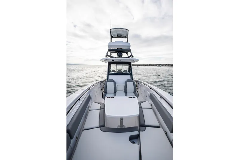 Slide: The Image of 2024 Everglades 365 Center Console boat on open water, showcasing sleek design and spacious seating. - 110