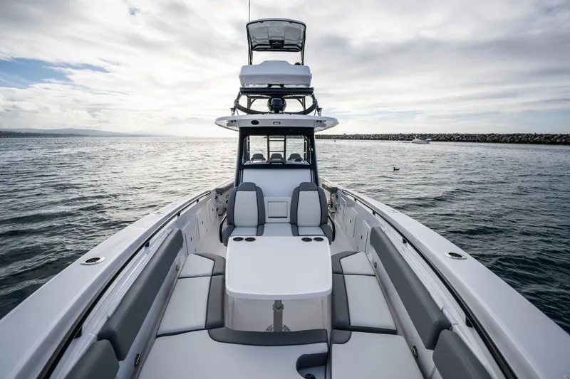 Slide: The Image of 2024 Everglades 365 Center Console boat on open water, showcasing luxury seating and design. - 112