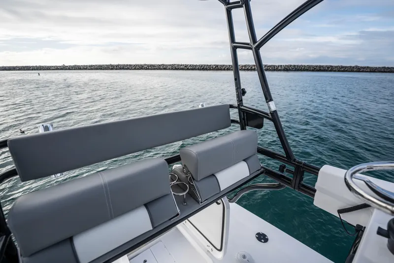 Slide: The Image of 2024 Everglades 365 Center Console boat interior with ocean view, featuring sleek seating and sturdy frame. - 114