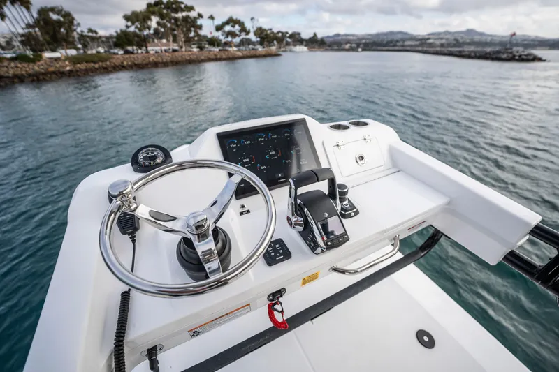 Slide: The Image of 2024 Everglades 365 Center Console helm with modern controls on open water. - 116