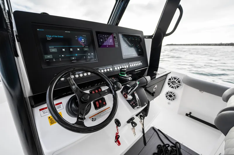 Slide: The Image of 2024 Everglades 365 Center Console boat dashboard with advanced controls and displays. - 120