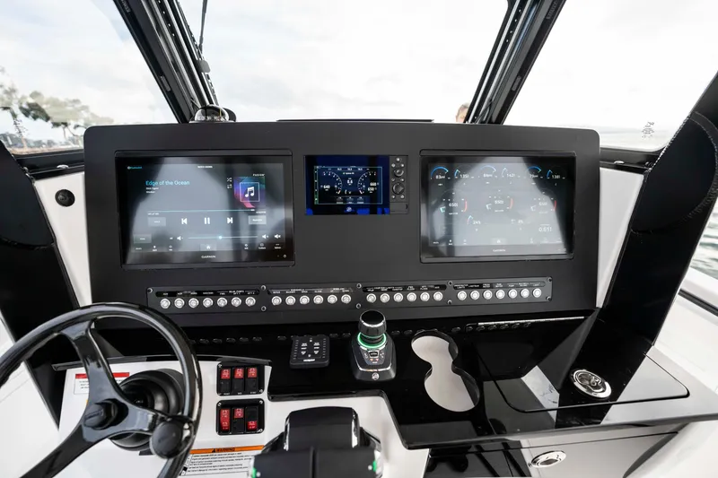 Slide: The Image of 2024 Everglades 365 Center Console dashboard with advanced navigation and control systems. - 123