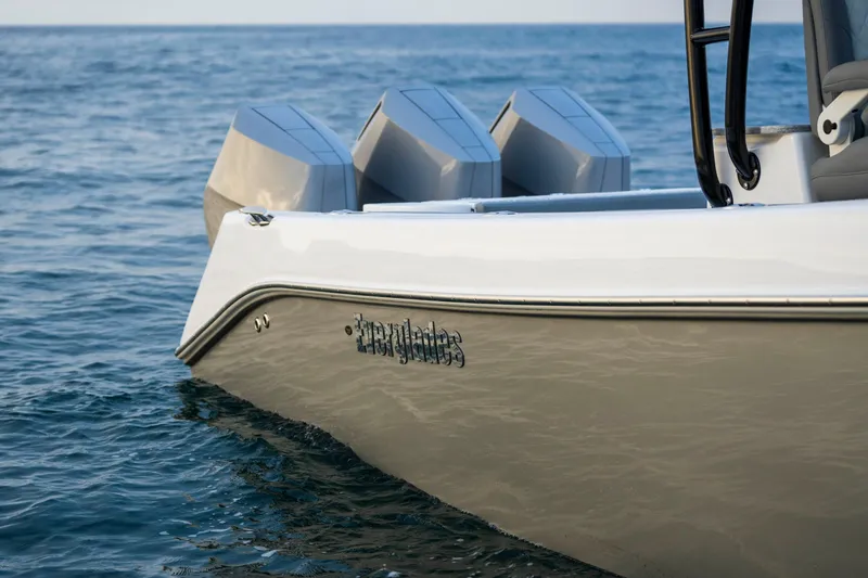 Slide: The Image of 2024 Everglades 365 Center Console boat on calm ocean waters. - 15