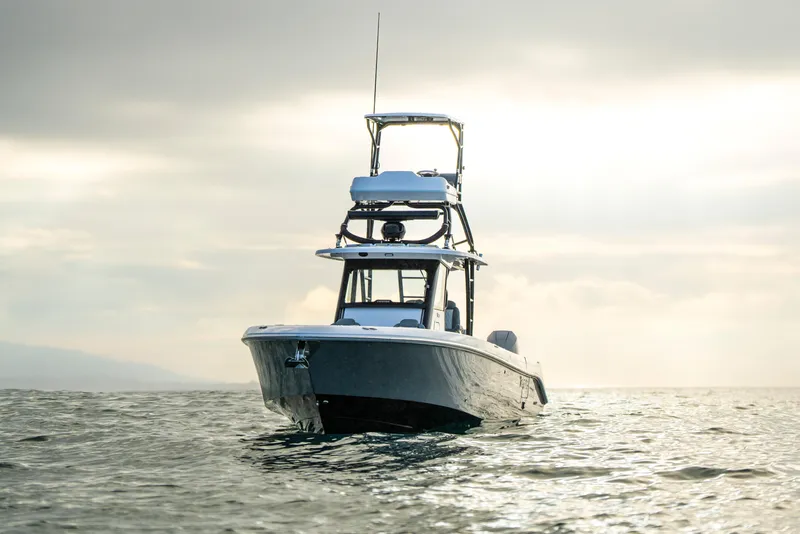 Slide: The Image of 2024 Everglades 365 Center Console boat on open water at sunrise. - 23