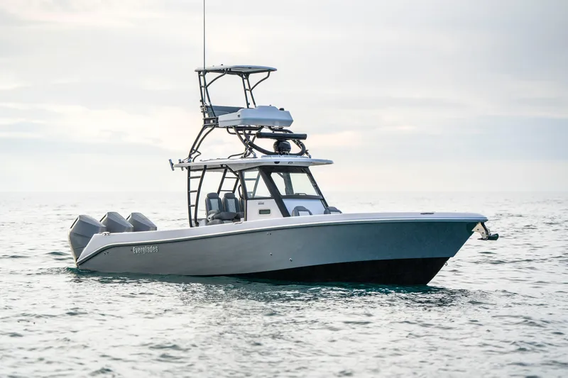 Slide: The Image of 2024 Everglades 365 Center Console boat on calm ocean waters. - 27