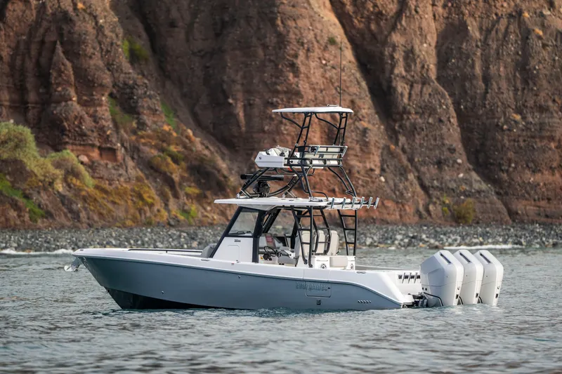 Slide: The Image of 2024 Everglades 365 Center Console boat on water near rocky cliffs. - 37