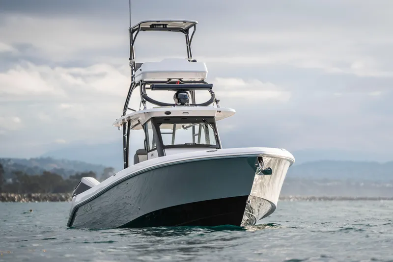 Slide: The Image of 2024 Everglades 365 Center Console boat on open water, showcasing sleek design. - 41