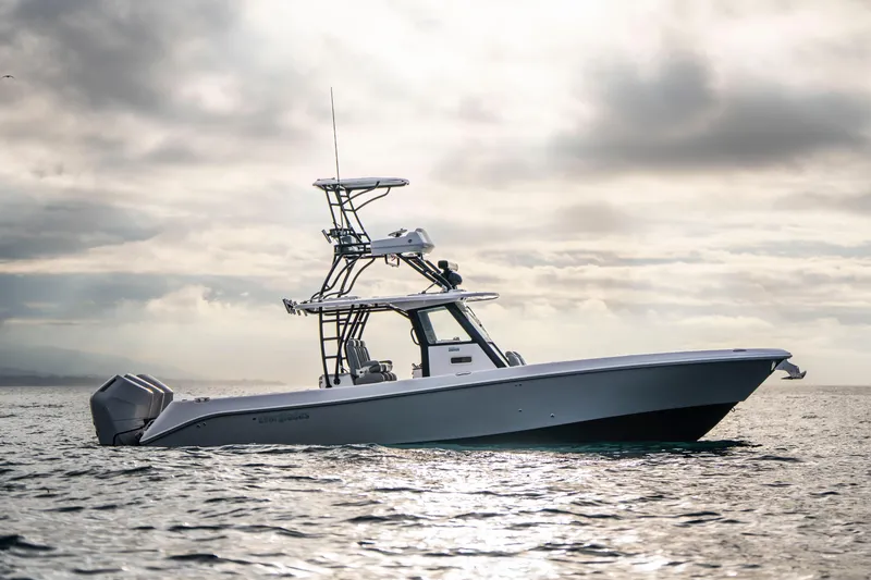 Slide: The Image of 2024 Everglades 365 Center Console boat on calm ocean under cloudy sky. - 45
