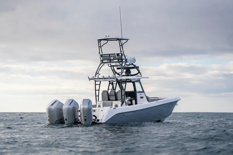 Slide: The Image of 2024 Everglades 365 Center Console boat on open water under cloudy sky. - 47