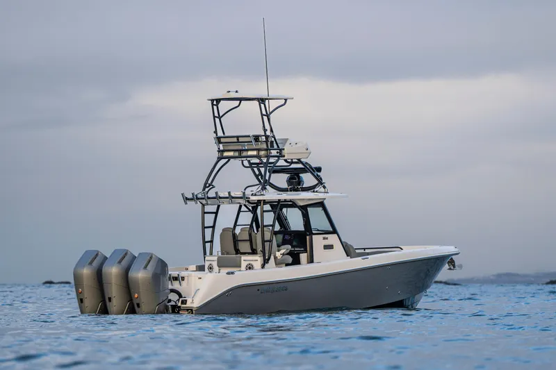 Slide: The Image of 2024 Everglades 365 Center Console boat on calm ocean waters. - 7