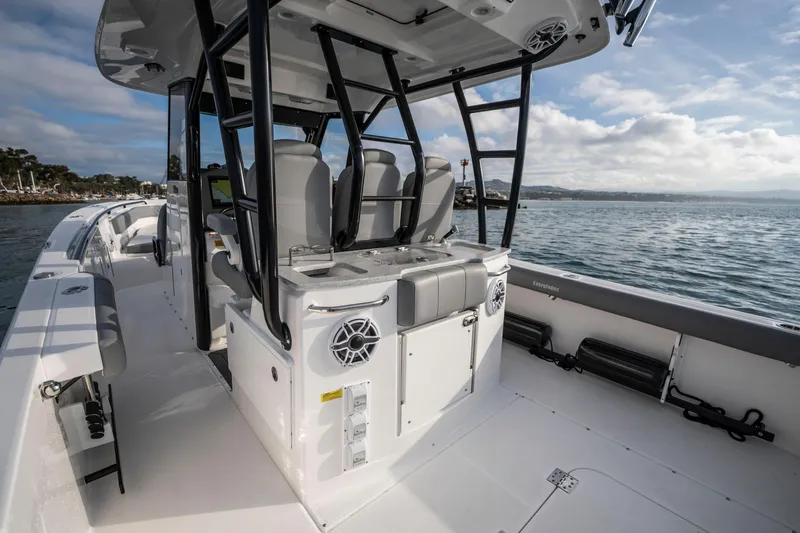 Slide: The Image of 2024 Everglades 365 Center Console boat interior with seating and ocean view. - 93