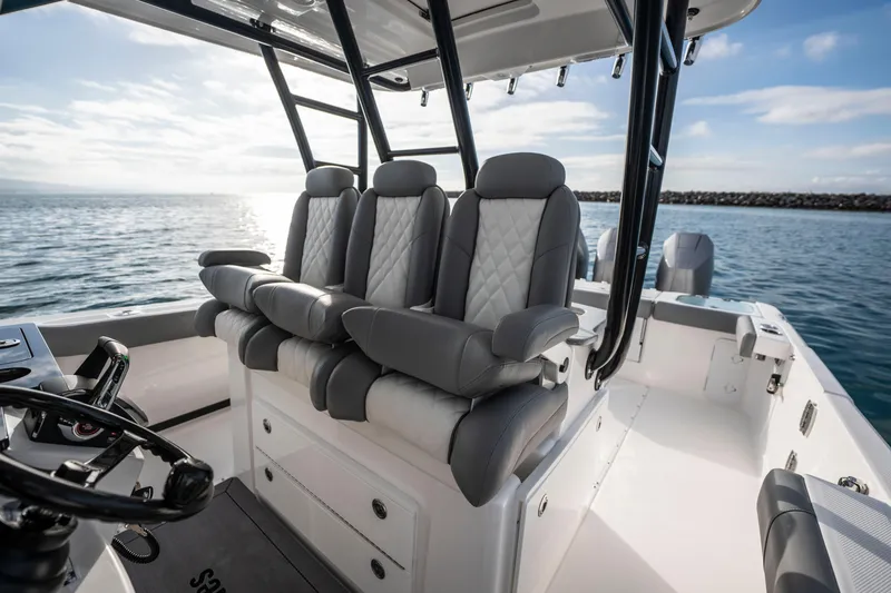 Slide: The Image of 2024 Everglades 365 Center Console boat interior with luxurious seating on open water. - 94