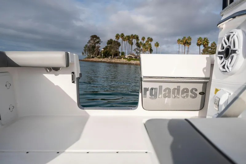 Slide: The Image of 2024 Everglades 365 Center Console boat with scenic water and palm trees. - 96