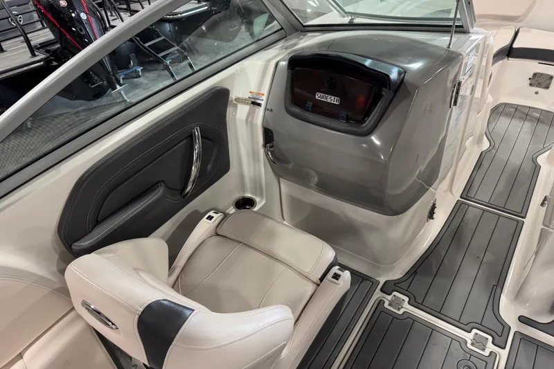 Slide: The Image of 2016 Chaparral 244 Xtreme boat interior with seating and storage compartment. - 12