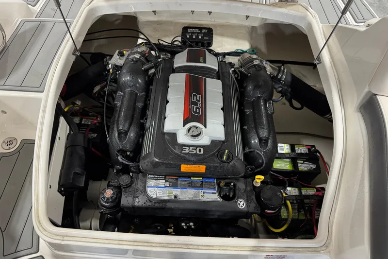 Slide: The Image of Engine compartment of 2016 Chaparral 244 Xtreme boat, featuring a 6.2L 350 horsepower engine. - 14