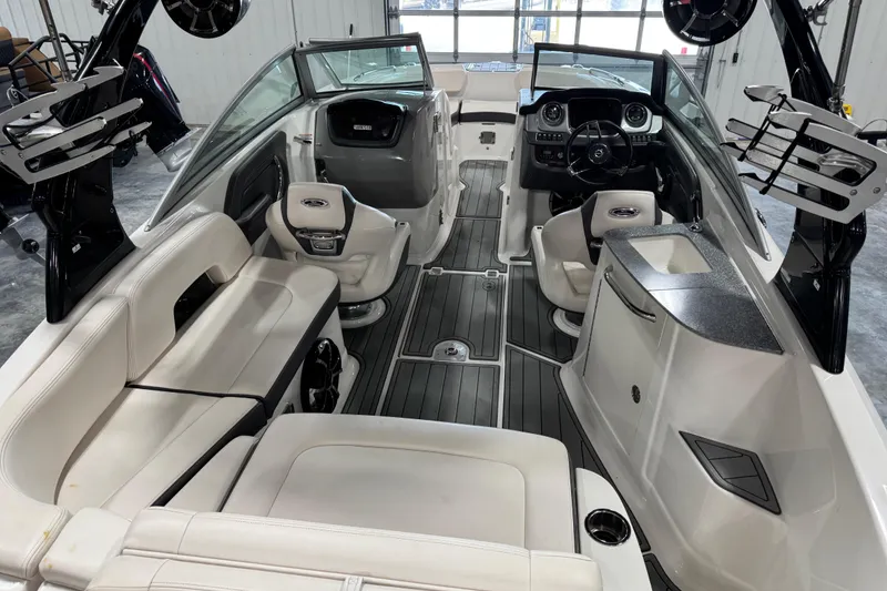 Slide: The Image of 2016 Chaparral 244 Xtreme boat interior with luxurious seating and modern dashboard. - 6