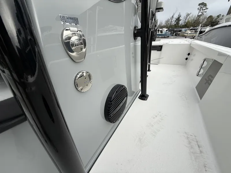 Slide: The Image of Sea Pro 250 Bay 2026 boat walkway with speaker and water connection. - 9
