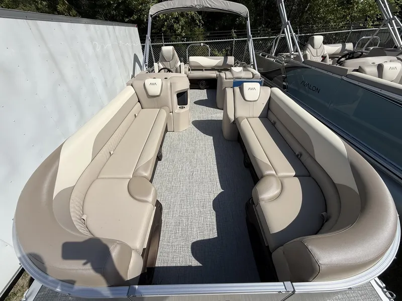 Slide: The Image of 2026 Avalon LSZ 25 pontoon boat with versatile rear bench. - 2