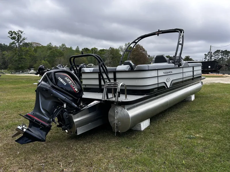 Slide: The Image of 2026 Veranda Vista Series pontoon boat parked on grass. - 3