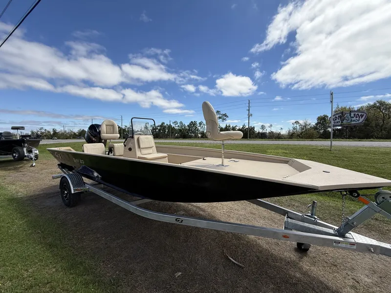The Image of 2026 G3 Bay 20 boat on trailer under blue sky. - 1
