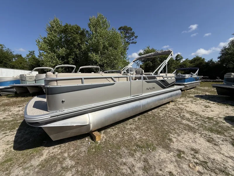 The Image of 2026 Avalon Venture 85 pontoon boat with 140HP, parked outdoors. - 1