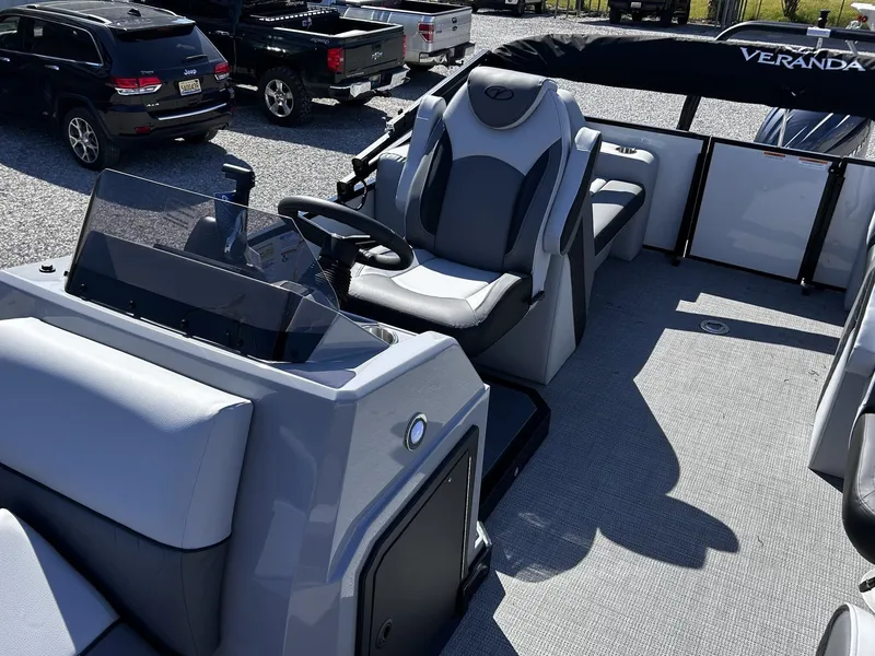Slide: The Image of Interior of 2026 Veranda Vista Series TRITOON-150HP with gray seating. - 10
