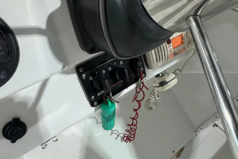 Slide: The Image of Control panel of a 2003 Glacier Bay 2640SX Renegade boat with ignition keys. - 18