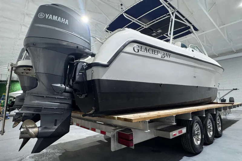 Slide: The Image of 2003 Glacier Bay 2640SX Renegade boat on trailer, featuring Yamaha outboard engines. - 3