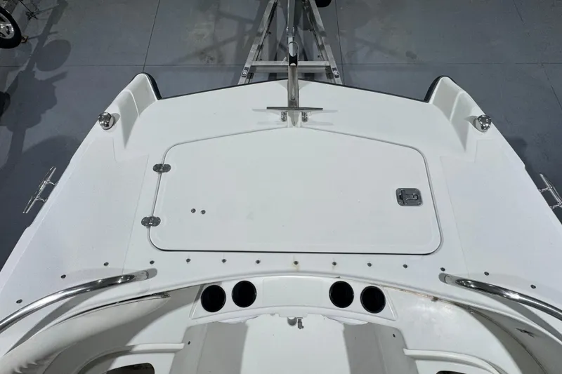 Slide: The Image of 2003 Glacier Bay 2640SX Renegade boat deck with storage hatch and stainless steel fittings. - 32