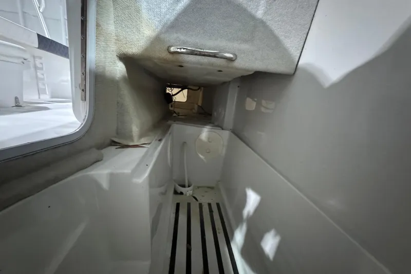 Slide: The Image of Interior view of 2003 Glacier Bay 2640SX Renegade boat cabin, featuring compact design. - 38
