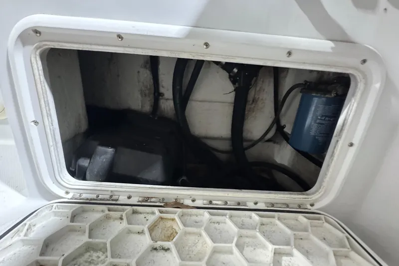 Slide: The Image of Access hatch of a 2003 Glacier Bay 2640SX Renegade boat, showing internal components. - 44