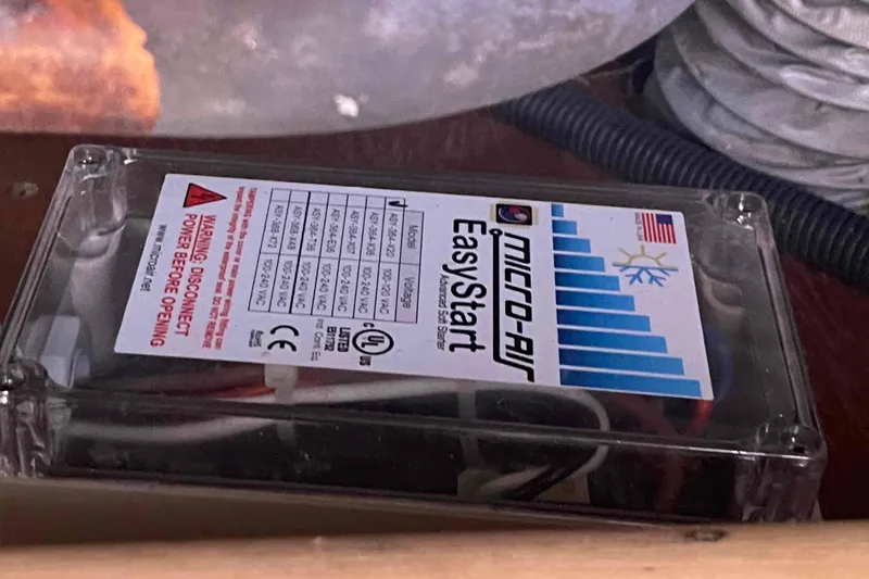 Slide: The Image of Micro-Air EasyStart device in a Hunter 36, 2006 model, with warning label visible. - 13