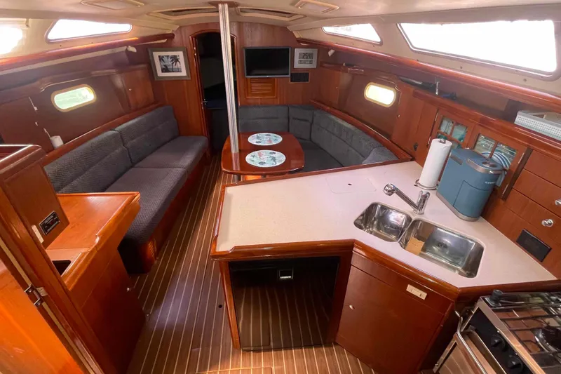 Slide: The Image of Interior of 2006 Hunter 36 sailboat with wood finish and modern amenities. - 2