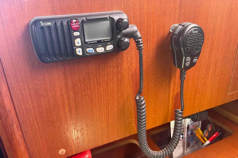 Slide: The Image of VHF marine radio on 2006 Hunter 36 sailboat, mounted on wooden panel. - 24