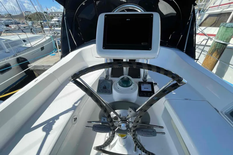 Slide: The Image of Steering wheel and navigation equipment on a 2006 Hunter 36 sailboat. - 35