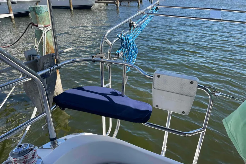 Slide: The Image of Hunter 36 sailboat stern view with blue cushion and mooring ropes, 2006 model. - 38