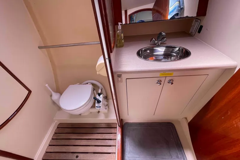 Slide: The Image of Compact bathroom in 2006 Hunter 36 yacht with sink and toilet. - 4