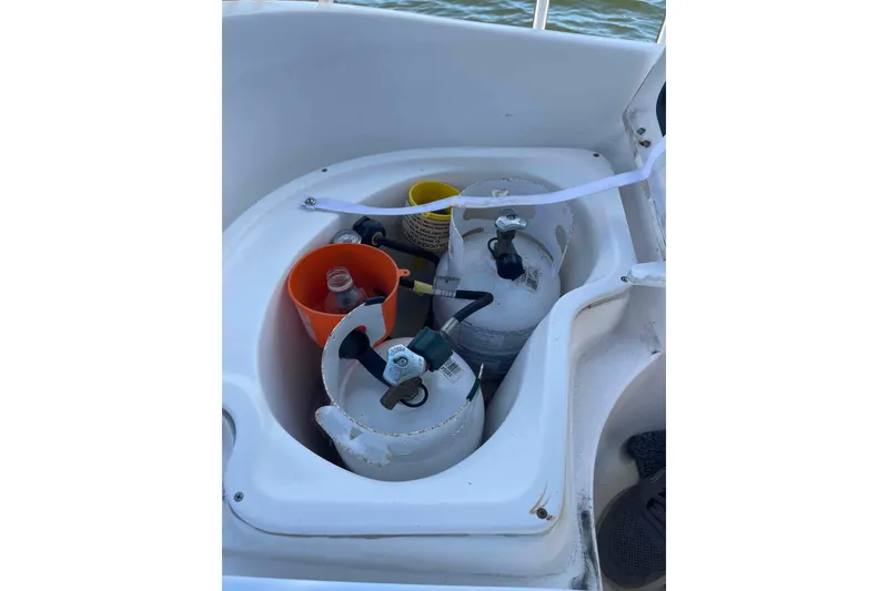 Slide: The Image of Storage compartment with propane tanks on a 2006 Hunter 36 boat. - 40