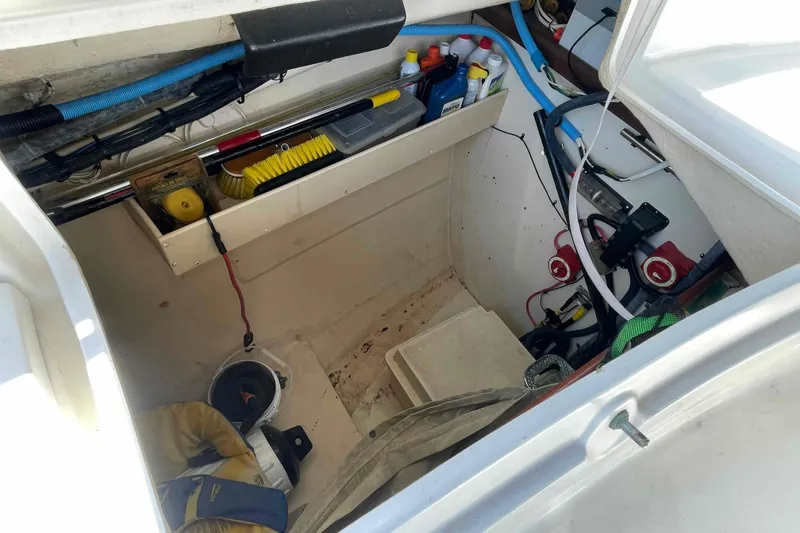 Slide: The Image of Storage compartment of a 2006 Hunter 36 sailboat with tools and maintenance supplies. - 41