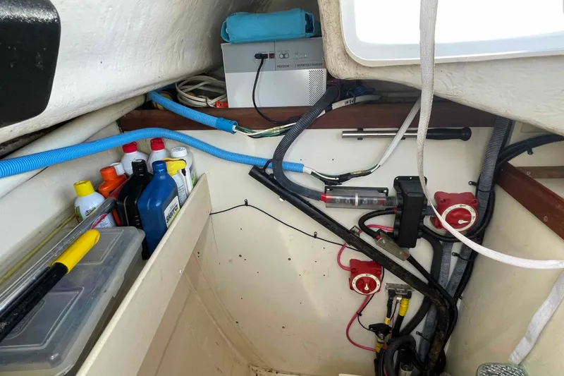Slide: The Image of Interior of a 2006 Hunter 36 sailboat showing storage and electrical components. - 42