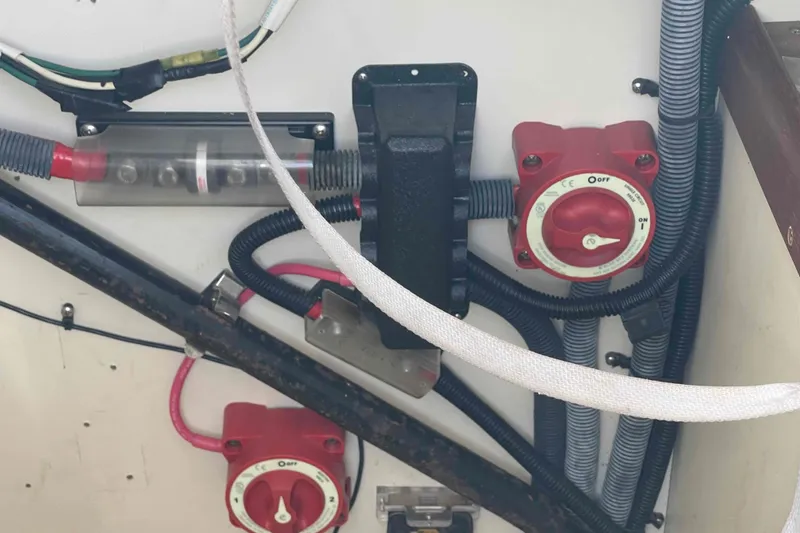 Slide: The Image of Electrical panel with switches and wiring in a 2006 Hunter 36 boat. - 43