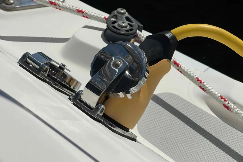 Slide: The Image of Close-up of a 2006 Hunter 36 sailboat deck with winch and rope. - 46