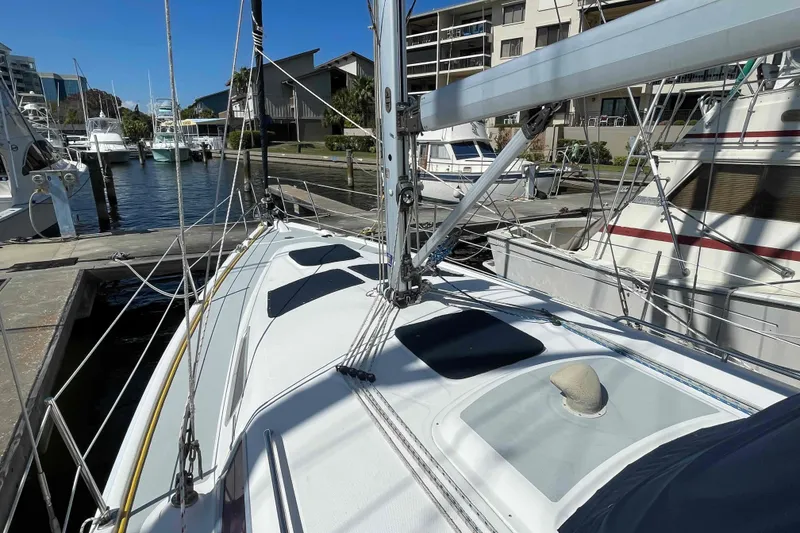 Slide: The Image of Hunter 36 sailboat from 2006 docked at a marina, showcasing deck and rigging. - 48