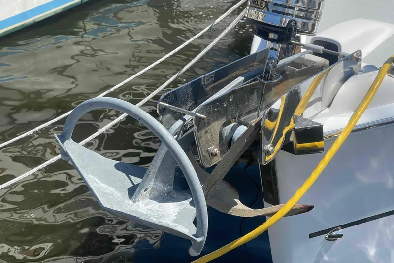 Slide: The Image of Anchor on a 2006 Hunter 36 sailboat, docked with water reflections. - 51