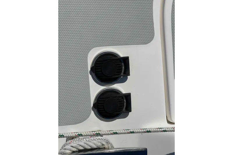 Slide: The Image of Close-up of dual black ports on a 2006 Hunter 36 boat deck. - 54