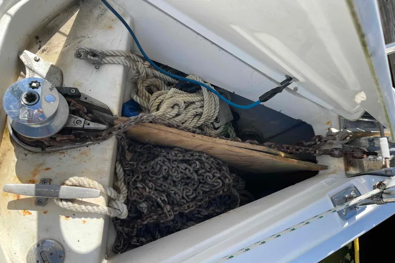 Slide: The Image of Anchor locker of 2006 Hunter 36 sailboat with ropes and chains. - 55