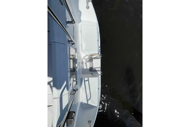 Slide: The Image of Top view of a 2006 Hunter 36 sailboat deck with stainless steel railings. - 59
