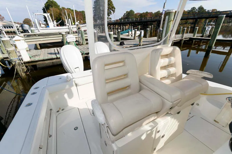 Slide: The Image of 2008 Hydra-Sports Vector 3500 VX boat interior with white seating at a marina. - 5