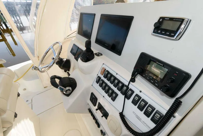 Slide: The Image of 2008 Hydra-Sports Vector 3500 VX boat dashboard with navigation controls and displays. - 8