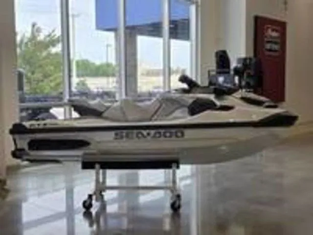 Slide: The Image of 2026 Sea-Doo GTX jet ski displayed in showroom. - 11
